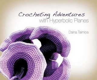 Click to visit Daina Taimina's blog. Book cover showing a crocheted hyperbolic plane