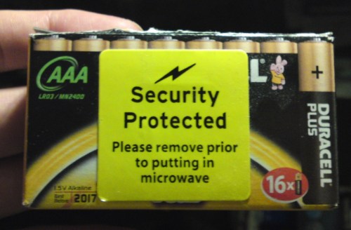 Box with sticker: "Please remove prior to putting in microwave"